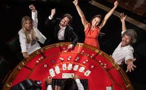 Live blackjack table streamed on mobile device with dealer and action